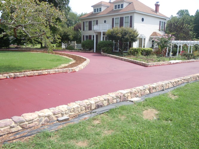 home with red ashpalt driveway striping Singleton Church Parking Lot